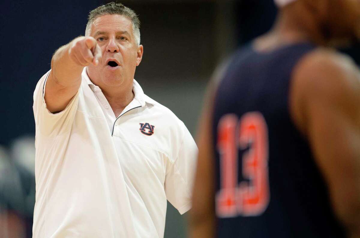 Auburn head coach Bruce Pearl directs his players during NCAA college basketball practice, Friday, Sept. 29, 2017, in Auburn, Ala. Auburn practiced for the first time this season since top assistant Chuck Person's arrest as part of a federal fraud and bribery sting. (Albert Cesare/The Montgomery Advertiser via AP)