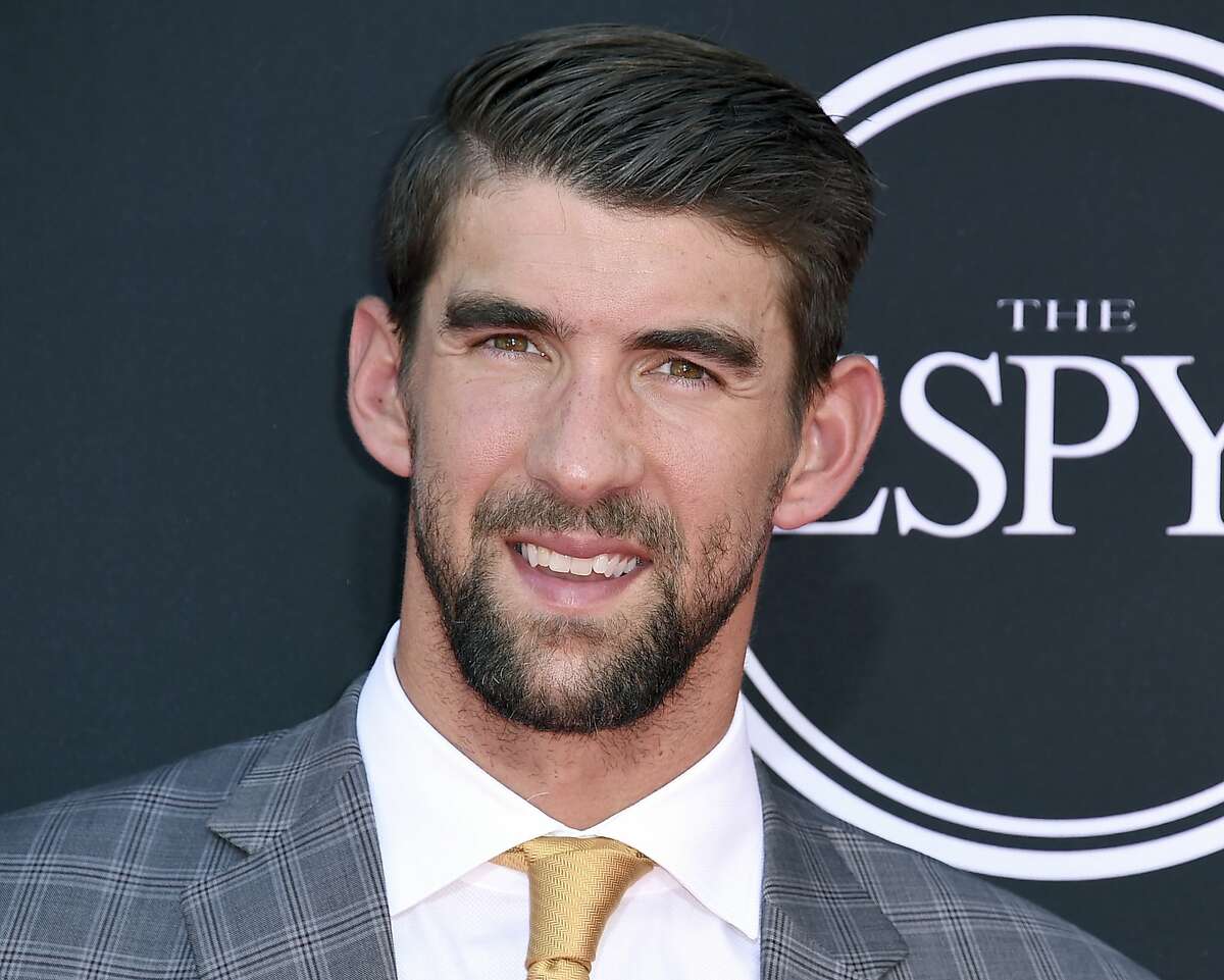 FILE - In this July 12, 2017 file photo, Olympic swimmer Michael Phelps arrives at the ESPYS in Los Angeles. Phelps appears in the documentary, “Angst” to share his story of being bullied and depressed. (Photo by Jordan Strauss/Invision/AP, File)