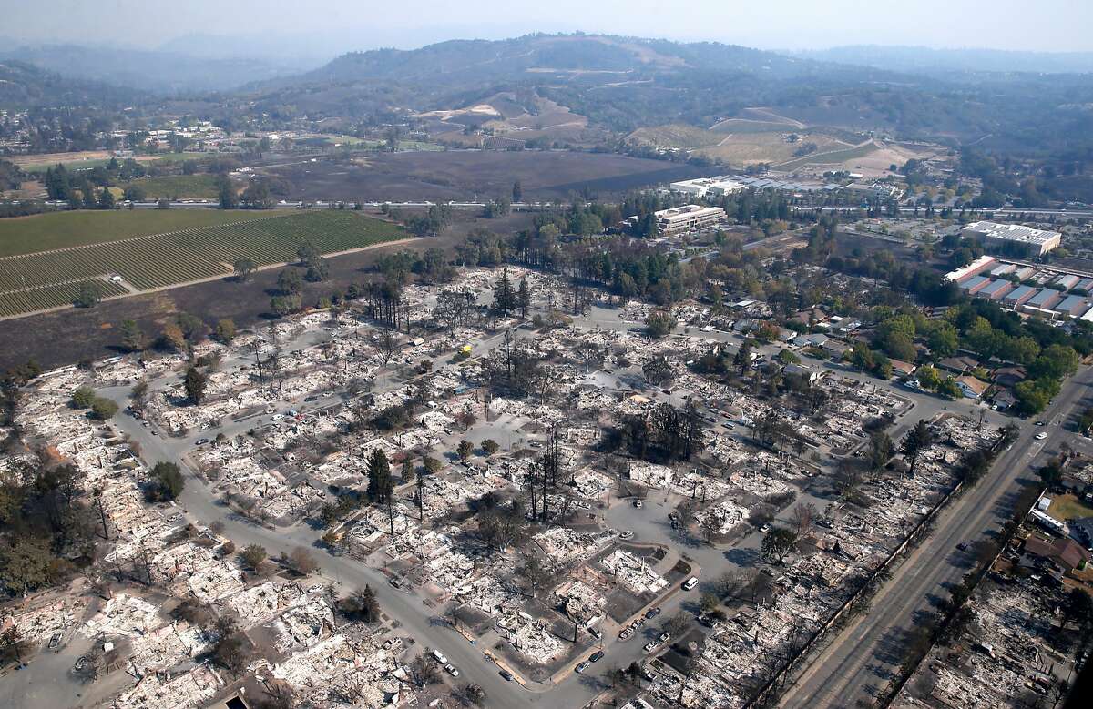An entire neighborhood of homes destroyed by Monday morning's firestorm are seen from the air in Santa Rosa, Calif. on Wednesday Oct. 11, 2017.