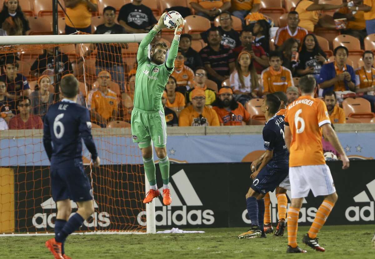 Houston Dynamo goalkeeper Tyler Deric (1) goes up to grab the ball during the second half of the MLS game at BBVA Compass Stadium Wednesday, Oct. 11, 2017, in Houston. Houston Dynamo defeated Sporting Kansas City 2-1. ( Yi-Chin Lee / Houston Chronicle )