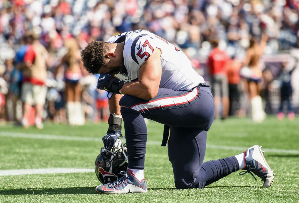 FOXBORO, MASSACHUSETTS - SEPTEMBER 24: Brennan Scarlett #57 of the Houston Texans kneels before a game against the New England Patriots at Gillette Stadium on September 24, 2017 in Foxboro, Massachusetts. (Photo by Billie Weiss/Getty Images)
