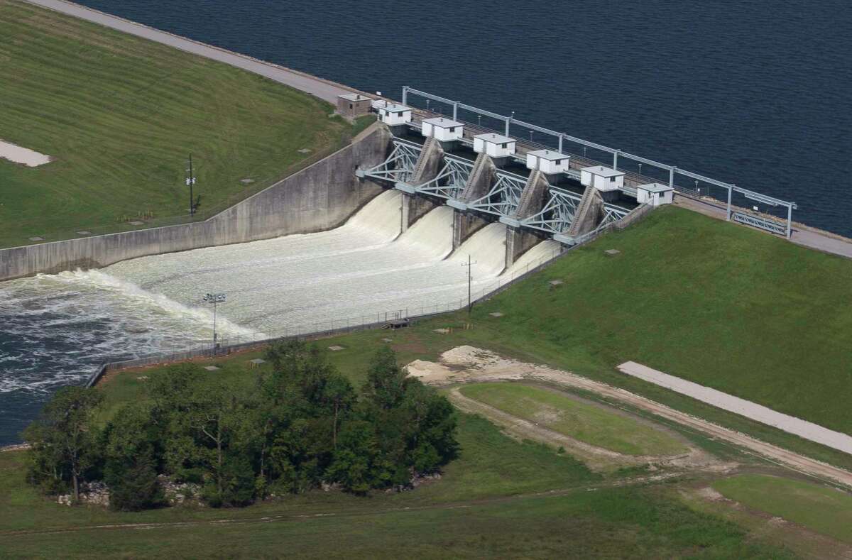The Conroe Dam releases water from Lake Conroe, Thursday, Aug. 31, 2017, in Conroe.