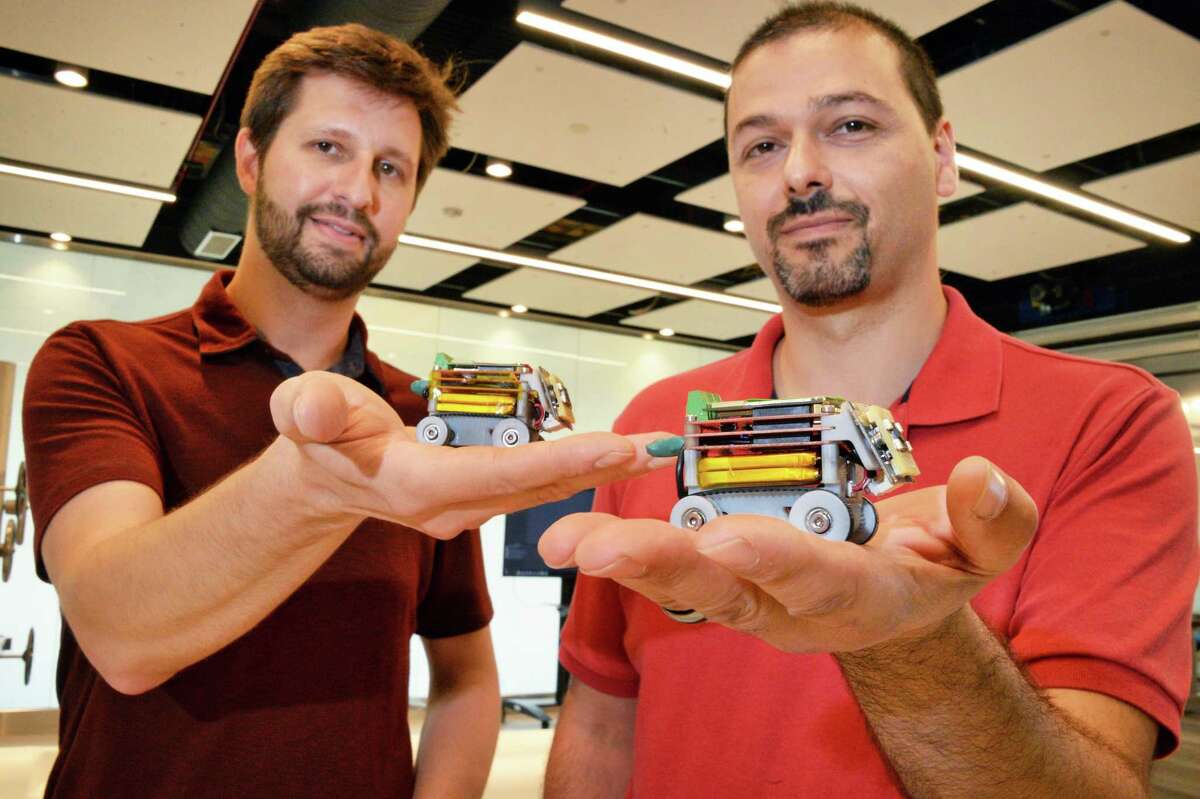 GE scientists and robotics researchers Todd Danko, left, and Don Lipkin with mini robots at GE Global Research Center Wednesday Oct. 11, 2017 in Niskayuna, NY. (John Carl D'Annibale / Times Union)