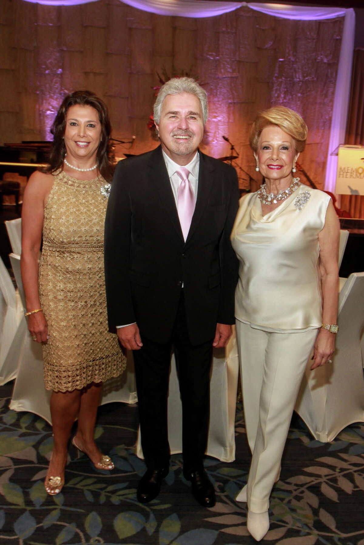 Regina Garcia, from left, Steve Tyrell and Philamena Baird at the Memorial Hermann Razzle Dazzle luncheon at the Westin Memorial City. Regina and Philamena are the event's chairs. (For the Chronicle/Gary Fountain, October 12, 2017)