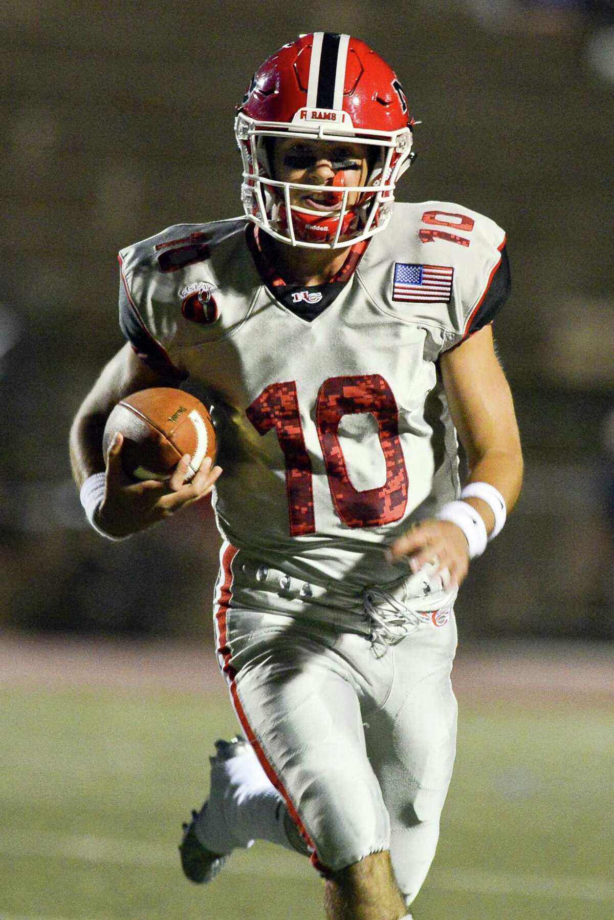 New Canaan quarterback Drew Pyne scrambles for a touchdown against Westhill on Sept. 28 at Boyle Stadium in Stamford.