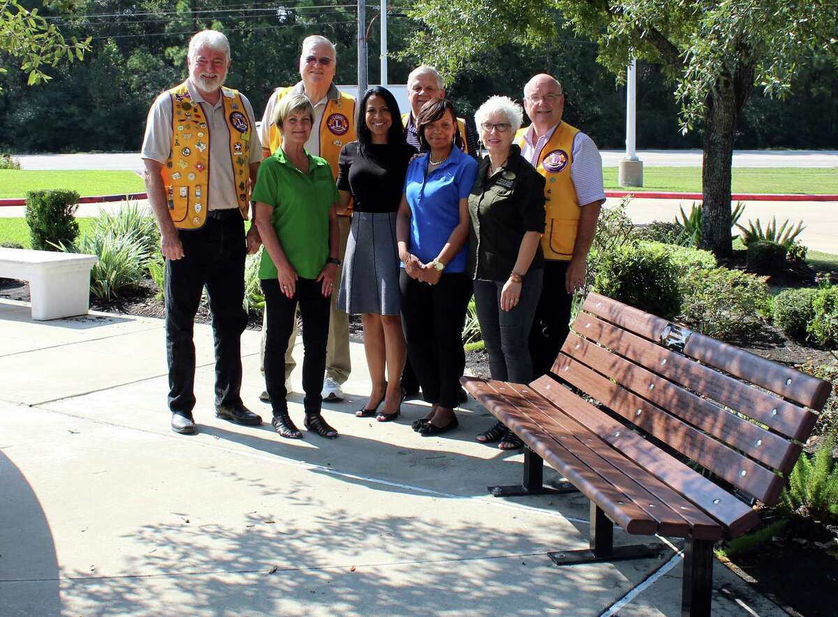 Representatives of the Humble Noon Lions Club and Humble Civic Center stand beside the bench donated to the Humble Civic Center on Thursday, Oct. 12, by the Humble Noon Lions Club in honor of the Lions Club International centennial. From left to right: Neil Lander,Â Humble Noon Lions Club; Joe Bocklage,Â Humble Noon Lions Club; Cindy Folsom, Humble Civic Center sales manager; Tony Austin,Â Humble Noon Lions Club; Jennifer Wooden, Humble Civic Center director; Kim Branch, Humble Civic Center sales manager; Gary Fritz,Â Humble Noon Lions Club; Pat Gill, Humble Civic Center administrative assistant.
