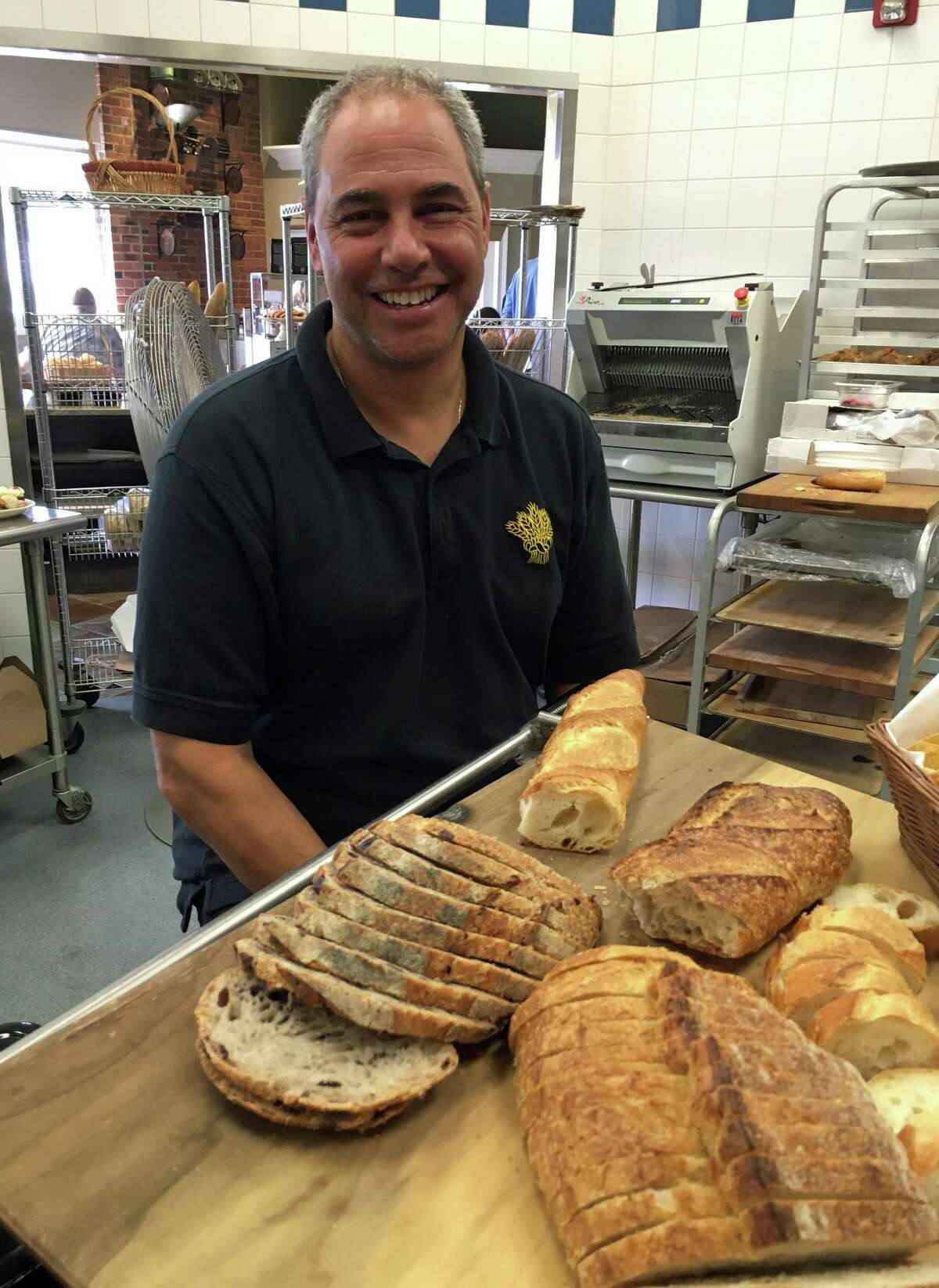 John Barricelli, owner, baker and chef of SoNo Baking Company & Cafe, creates dozens of baked goods, including bread.