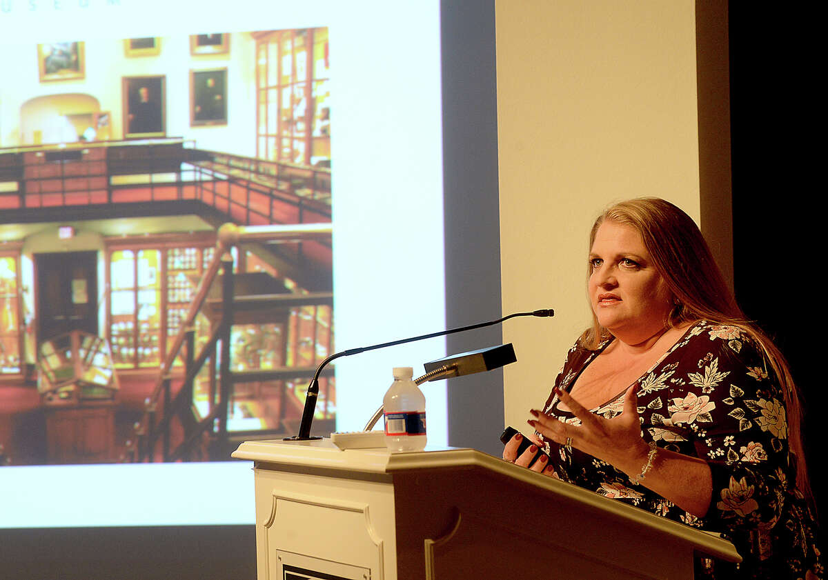 Mutter Museum educator Marcy Engleman addresses the standing-room only crowd during her lecture at the McFaddin - Ward House Visitor Center Thursday. Engleman offered the audience a virtual tour of the Philadelphia-based museum's collection of medical anomalies, mysteries, and other macabre exhibit highlights, including a sample of Einstein's brain. The event is part of the McFaddin - Ward Museum's annual lecture series. Photo taken Thursday, October 12, 2017 Kim Brent/The Enterprise