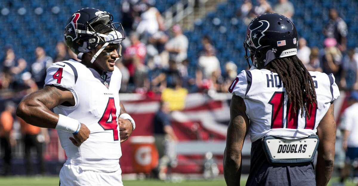 Houston Texans quarterback Deshaun Watson (4) and wide receiver DeAndre Hopkins (10) talk before Texans NFL football game againt the New England Patriots at Gillette Stadium on Sunday, Sept. 24, 2017, in Foxbourough, Mass. ( Brett Coomer / Houston Chronicle )
