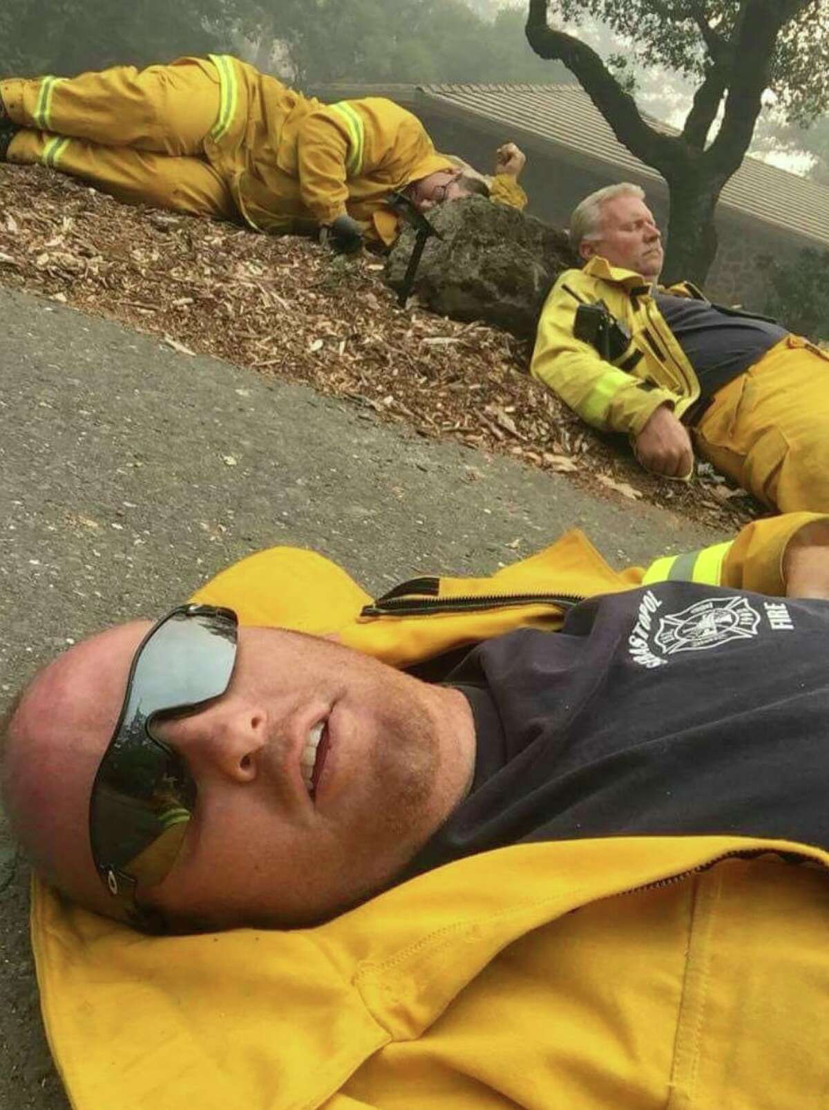 Kiara Evan shared this photo of exhausted first responders taking a break while fighting the Wine Country fires.