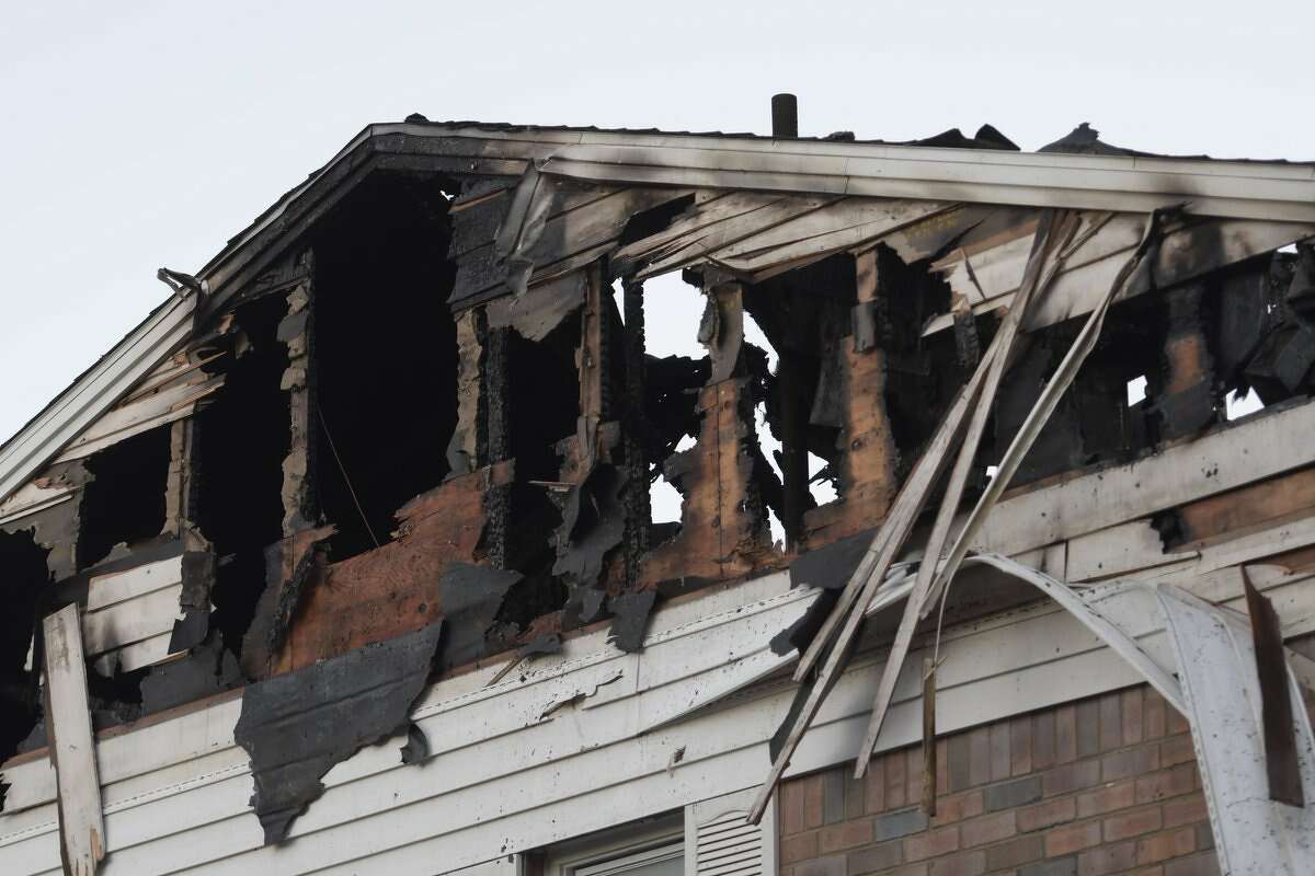 Friday's rising sun revealed the damage cause by a fire Thursday night at an apartment complex on Cottage Street in Troy.