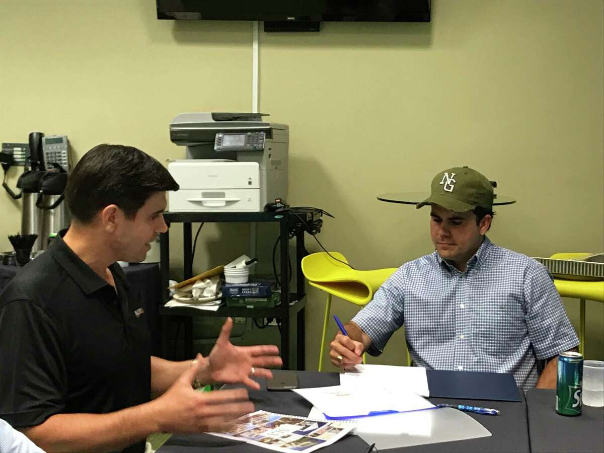 Sunnova CEO John Berger, left, talks with Puerto Rican Gov. Ricardo Rosselló about his Houston-based companies effort with solar and battery systems to alleviate the sweeping power outage caused by Hurricane Maria.