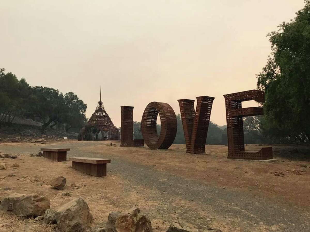 The "Love" sculpture at Paradise Ridge Winery was singed but otherwise not damaged by the Tubbs Fire, which leveled the Santa Rosa winery. Peter Byck, whose brother, Rene, runs the winery said, "The temple behind the 'Love' sculpture is the temple of remembrance, which is to remember those we've lost."