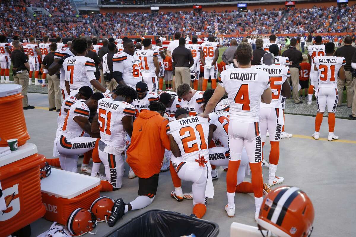 CLEVELAND, OH - AUGUST 21: A group of Cleveland Browns players kneel in a circle in protest during the national anthem prior to a preseason game against the New York Giants at FirstEnergy Stadium on August 21, 2017 in Cleveland, Ohio. (Photo by Joe Robbins/Getty Images)