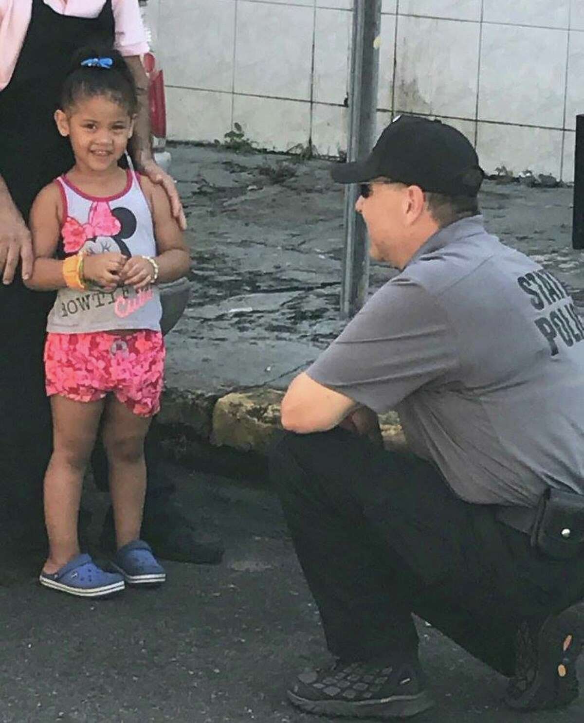 Click through for a slideshow of State Troopers helping out in Puerto Rica after Hurricane Maria. Troop G Zone Sgt. John Bellavigna talk to a little girl while conducting traffic stops in San Juan. Fifty-three troopers arrived in Puerto Rico on Friday, Sept. 29, 2017, to assist with law enforcement and humanitarian aid efforts as the U.S. territory recovers from the devastation of Hurricane Maria.