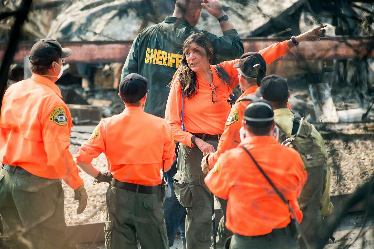 Search and rescue workers from the Sonoma County Sheriffs Office search for Tubbs fire victims at Journey's End Mobile Home Park on Friday, Oct. 13, 2017, in Santa Rosa, Calif. According Sgt. Dave Thompson, in charge of search and rescue operations for the Sonoma County Sheriffs Office, crews have recovered another body at the site.