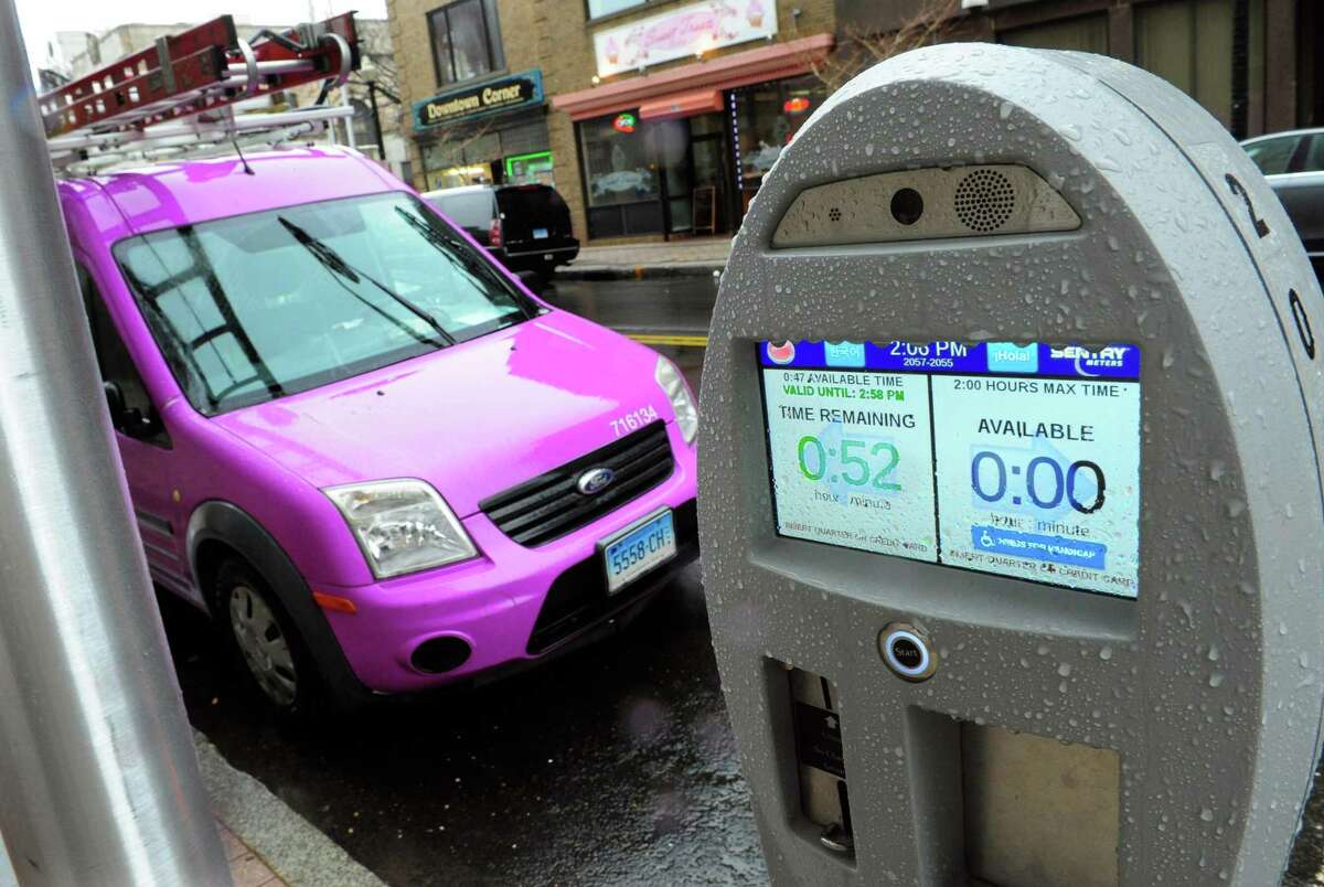 One of Bridgeport’s new parking meter displays the remaining time for a vehicle parked along Main Street in March. As part of an initiative to better educate the public about the new high-tech parking meters, the city has placed special stickers on the equipment emphasizing the meters use cameras to catch violators.