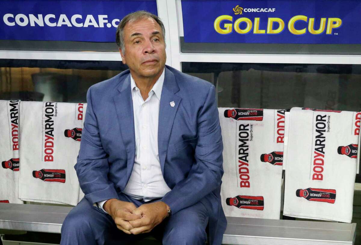 FILE - In this July 22, 2017, file photo, United States head coach Bruce Arena sits on the bench prior to a CONCACAF Gold Cup semifinal soccer match against Costa Rica, in Arlington, Texas. Arena has resigned in the wake of the teams U.S. national teamÂ?’s crash out of contention for the 2018 World Cup. Â?“We didnÂ?’t get the job done, and I accept responsibility,Â?” Arena said in a statement on Friday, Oct. 13, 2017.(AP Photo/LM Otero, File)