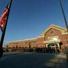 Flags are raised during the ceremony to officially open the doors of Troop G's new headquarters in Latham, N.Y. August 8, 2012. (Skip Dickstein/Times Union)