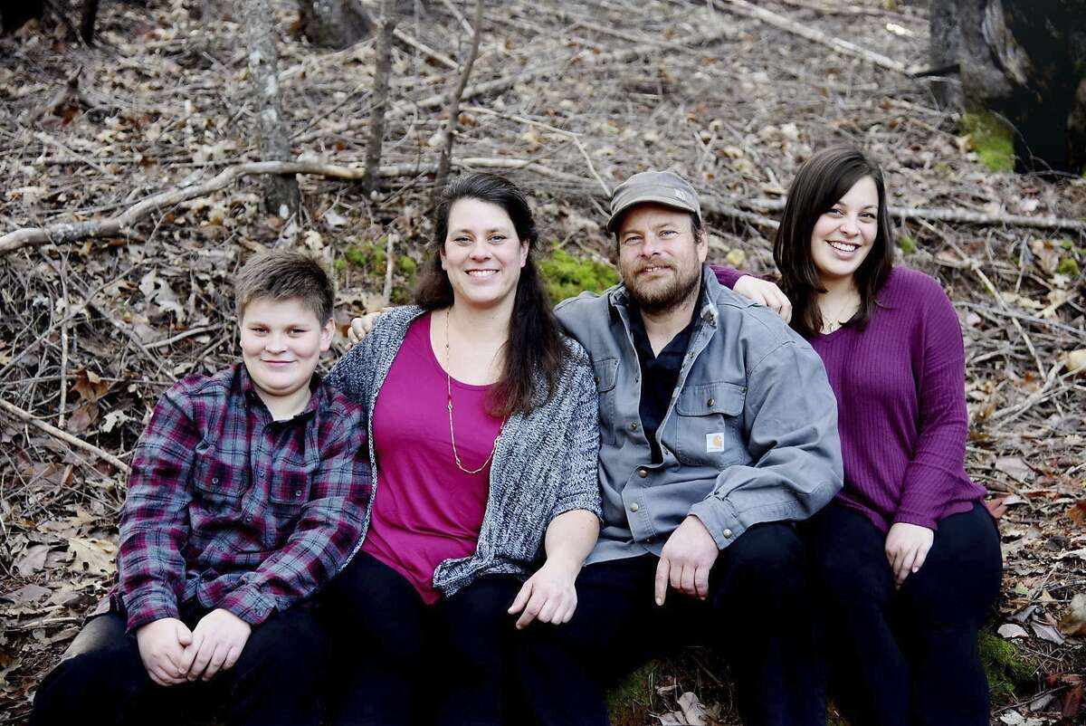 In this undated photo provided by Irma Muniz shows the Shepherd family, Jon and Sara Shepherd and their children, Kressa, and Kai. Kai, left, was killed after a wildfire tore through his family's home in Redwood Valley, Calif. on Monday, Oct. 9, 2017. He was 14 when he died, said his aunt, Mindi Ramos. Sara and 17-year-old daughter, Kressa, both sustained burns on 60% of their bodies. Jon sustained burns on 45% of his body. Relatives are trying to raise money to cover medical expenses and prepare to eventually bring the family to live with Sara's parents' home in Redwood Valley. (Irma Muniz via AP)
