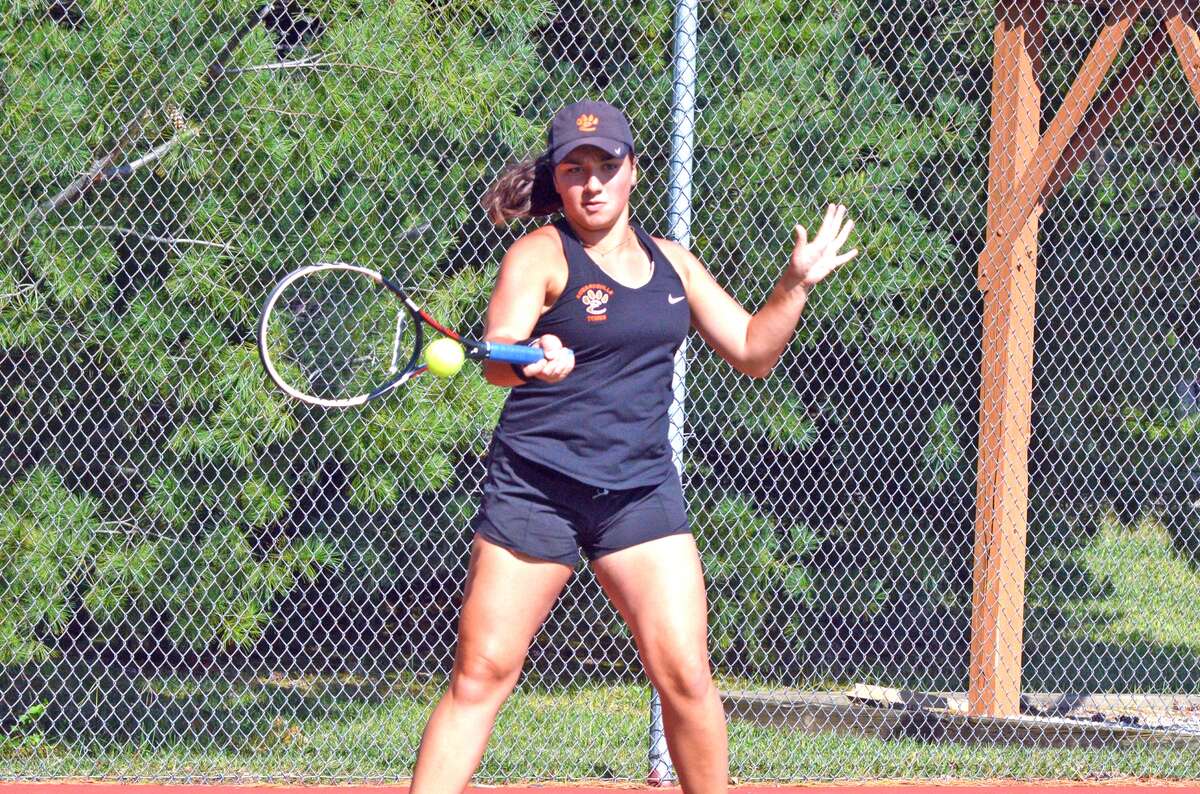 Edwardsville junior Natalie Karibian makes a forehand return during her first-round singles match on Friday in the Class 2A sectional at the EHS Tennis Center.