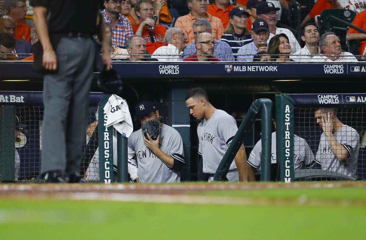 Yankees starting pitcher Masahiro Tanaka (left) and right fielder Aaron Judge (99) stand in the Minute Maid Park dugout during their Game 1 loss to the Astros in the 2017 ALCS.