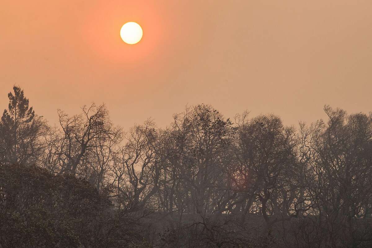 Sun rises behind burned out hillside east of the town of Sonoma, California, USA 14 Oct 2017.