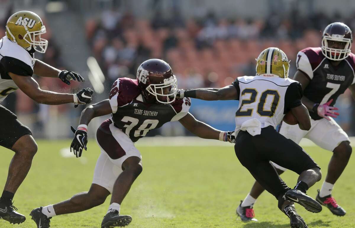 Texas Southern Tigers defensive back Marquis Walker (38) tackles Alabama State Hornets running back Ezra Gray (20) in the third quarter during the NCAA football game between the Alabama State Hornets and the Texas Southern Tigers at BBVA Compass Stadium in Houston, TX on Saturday, October 14, 2017.