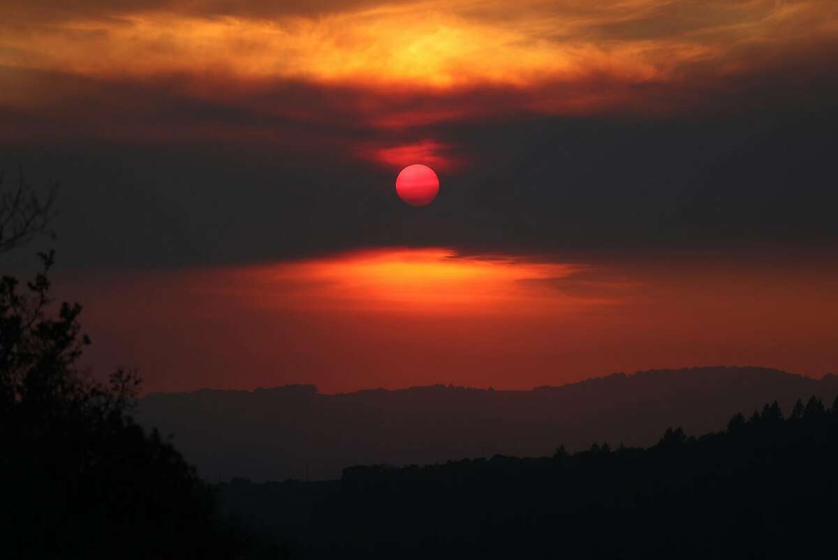 The sun sets over Sonoma, Calif., on Saturday, October 14, 2017.