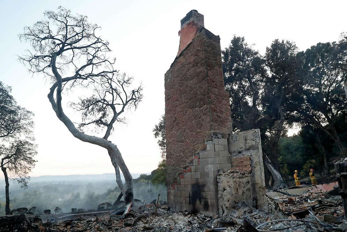 The chimney is all that remains standing at a large home that burned in The Ranch subdivision in Sonoma, Calif., on Saturday, October 14, 2017.