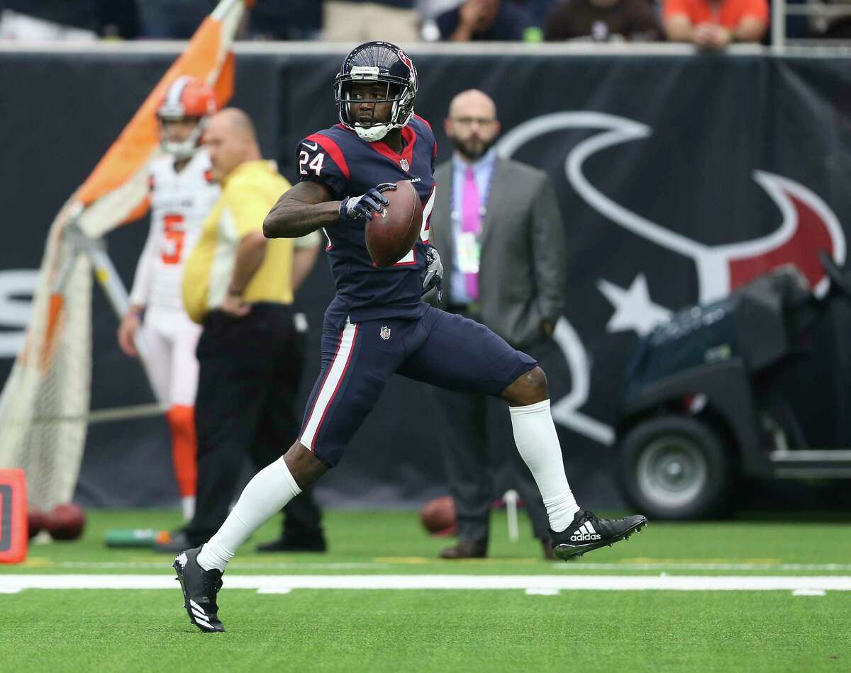 Houston Texans cornerback Johnathan Joseph (24) runs toward the endzone and scores a touchdown after intercepting a pass from Cleveland Browns during the second quarter of an NFL football game at NRG Stadium on Sunday, Oct. 15, 2017, in Houston.