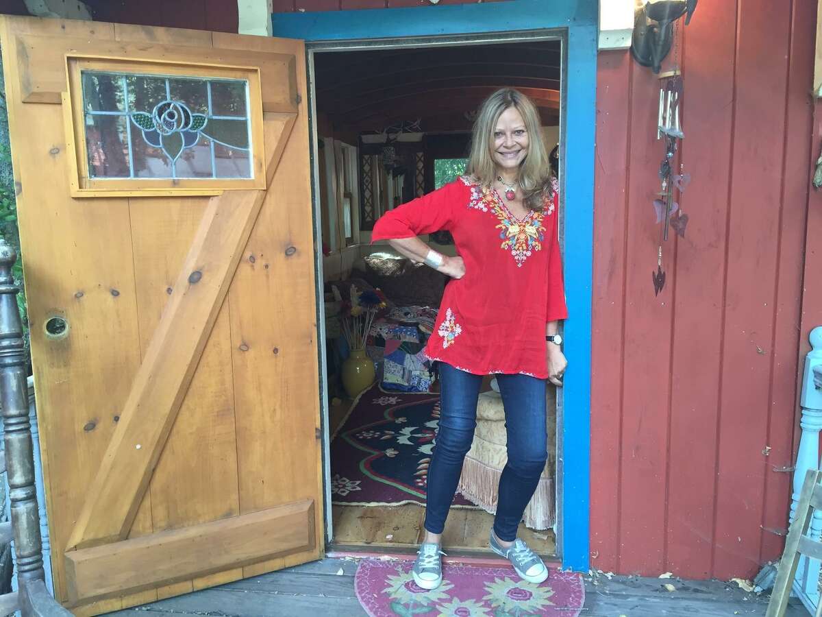 Joyce Maynard at the doorway of a “gypsy caravan” she keeps in the backyard of her Lafayette home.