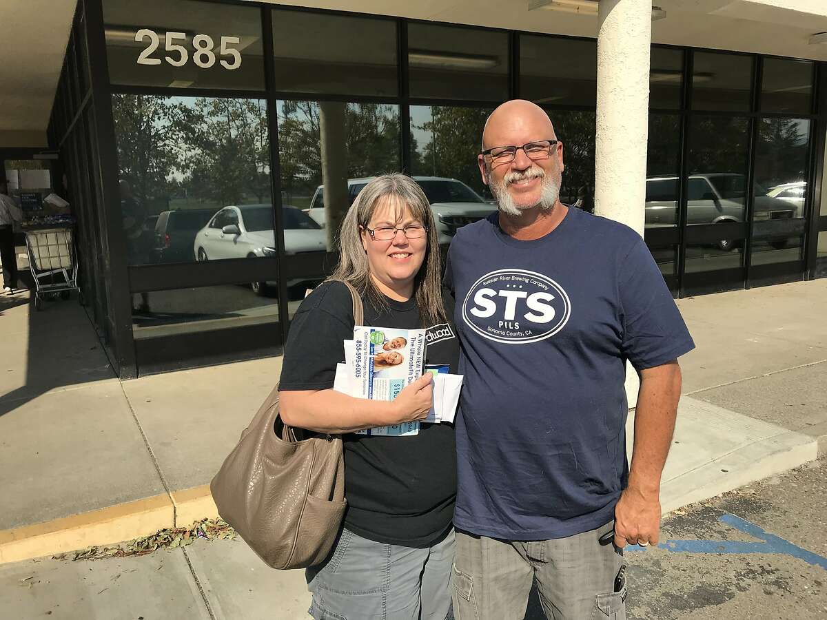 Kathy and Doug Braly collect their mail at their post office branch in Santa Rosa on Saturday.� Braly and two of her brothers all lost their homes in Coffey Park.