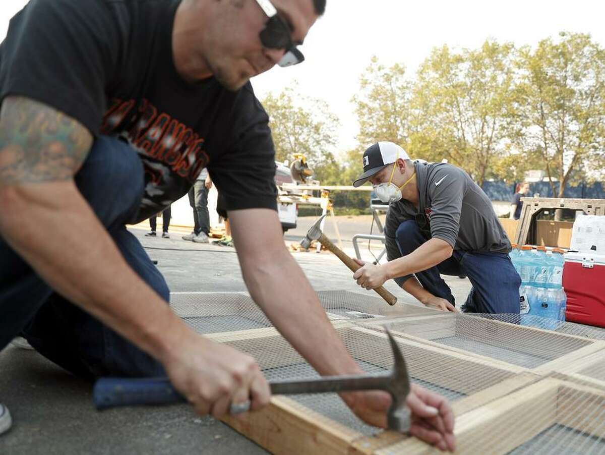 Pacific Coast Custom Interiors’ co-owner Evan Nelson (left) and Travis Sawyer make free ash sifters in Santa Rosa.
