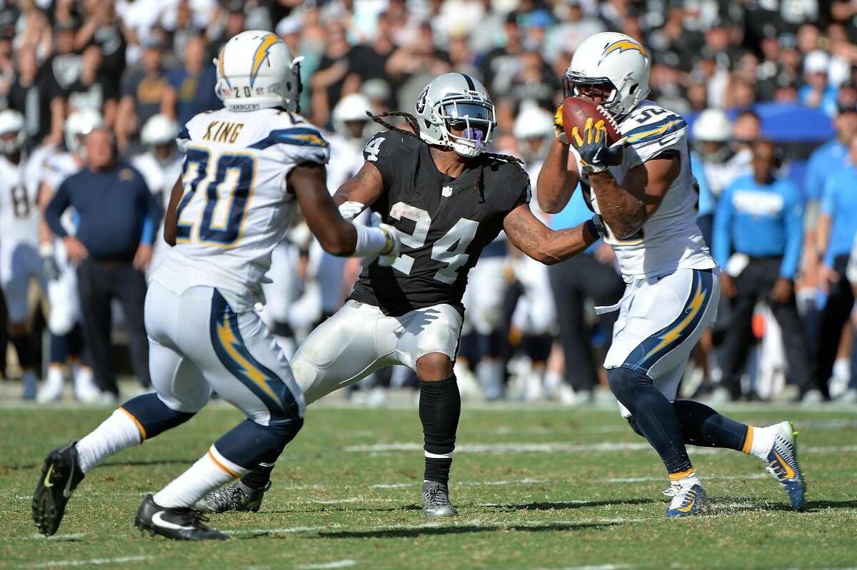 OAKLAND, CA - OCTOBER 15: Hayes Pullard III #50 of the Los Angeles Chargers intercepts a ball tipped by Marshawn Lynch #24 of the Oakland Raiders during their NFL game at Oakland-Alameda County Coliseum on October 15, 2017 in Oakland, California. (Photo by Don Feria/Getty Images)