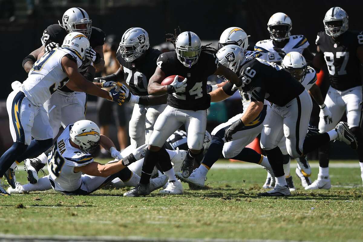OAKLAND, CA - OCTOBER 15: Marshawn Lynch #24 of the Oakland Raiders rushes with the ball against the Los Angeles Chargers during their NFL game at Oakland-Alameda County Coliseum on October 15, 2017 in Oakland, California. (Photo by Thearon W. Henderson/Getty Images)