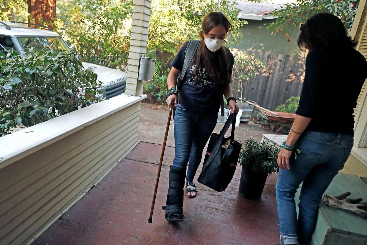 After the evacuation order was lifted, Sofia Osborne, 15 and her mother, Kim Wedlake, return to their home on Cedar Street in Calistoga, Calif., on Sunday, October 15, 2017.