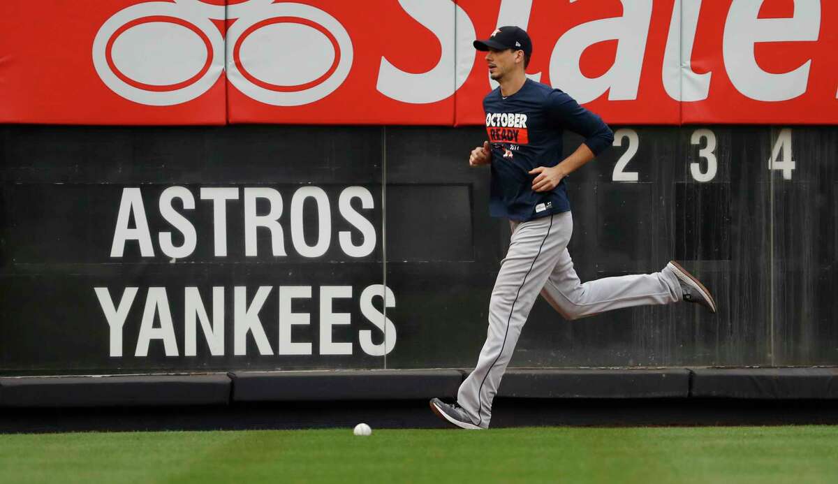 Astros pitcher Charlie Morton runs on the Yankee Stadium warning track Sunday. Morton, who grew up a Yankees fan, is calling his Game 3 start Monday the biggest game of his career.