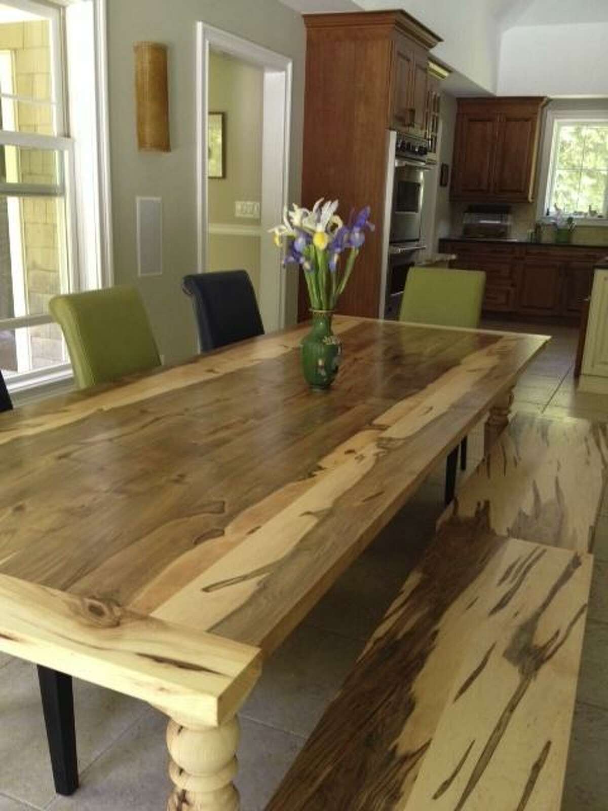 A farm-style table made by City Bench for a Woodbridge family from a tree that fell on their property.