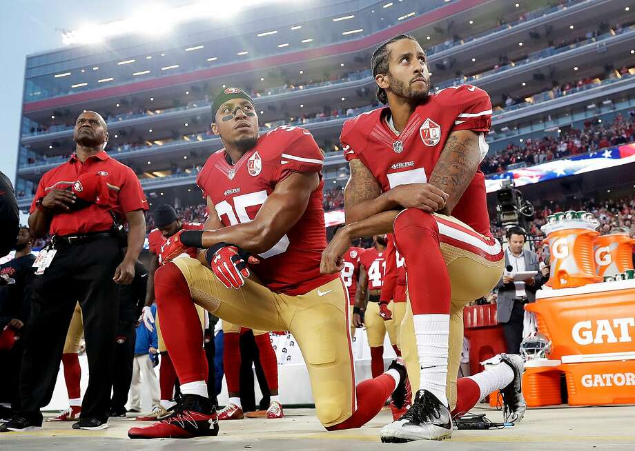 FILE - Int his Monday, Sept. 12, 2016, file photo, San Francisco 49ers safety Eric Reid (35) and quarterback Colin Kaepernick (7) kneel during the national anthem before an NFL football game against the Los Angeles Rams in Santa Clara, Calif. The dozen NFL players who have joined Kaepernick’s protest of social injustices by kneeling or raising a fist during the national anthem have faced vitriolic, sometimes racist reactions on social media and at least one has lost endorsements. None are deterred by the backlash. (AP Photo/Marcio Jose Sanchez, File) Photo: Marcio Jose Sanchez, Associated Press