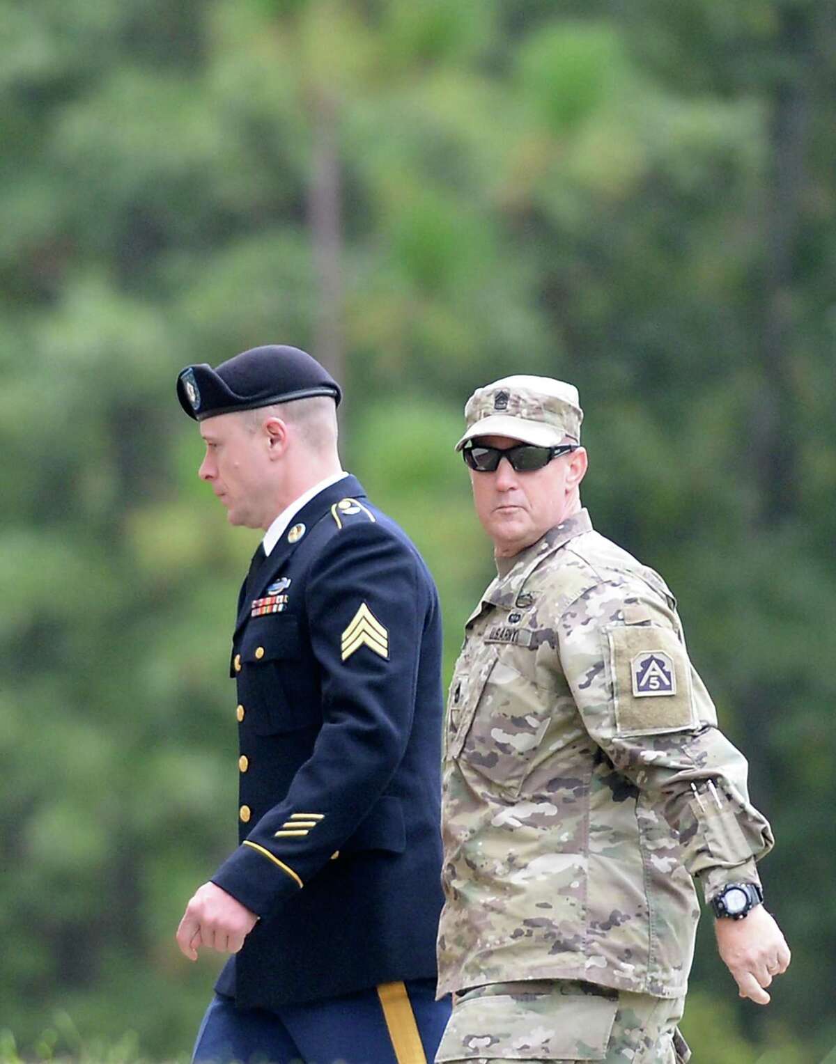 FORT BRAGG, NC - OCTOBER 16: U.S. Army Sgt. Robert Bowdrie (L), 29 of Hailey, Idaho, is escorted into the Ft. Bragg military courthouse for a motions hearing on October 16, 2017 in Fort Bragg, North Carolina. Bergdahl faces charges of desertion and endangering troops stemming from his decision to leave his outpost in 2009, which landed him five years in Taliban captivity. (Photo by Sara D. Davis/Getty Images)