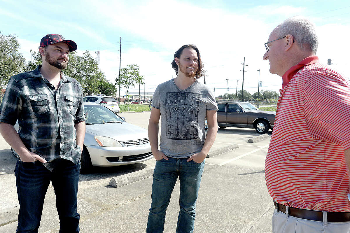 Nederland native Tim Foust (center) and Home Free bandmate Adam Chance greet Dan Maher, Executive Director of the SETX Food Bank, during a stop at the facility to deliver a donation of $15,000 Monday. The money will provide 45,000 meals to those in need. Home Free started a YouCaring fundraising site to aid those in communities throughout Southeast Texas impacted by Tropical Storm Harvey. They have currently raised over $85, 000 of their $100,000 goal. The band, which is currently on its Timeless World Tour, played a show in Lufkin Sunday night, and Foust and Chance decided to take advantage of a free day before heading to Arizona to visit the area and hand deliver some of their donations. Stops Monday included two Orange County schools to whom they have donated materials and instruments to replace those which music students lost to flooding. A large contribution was also made to Nederland Avenue Church of Christ's disaster relief fund to be distributed appropriately to various other schools and victims of Harvey. Photo taken Monday, October 16, 2017 Kim Brent/The Enterprise