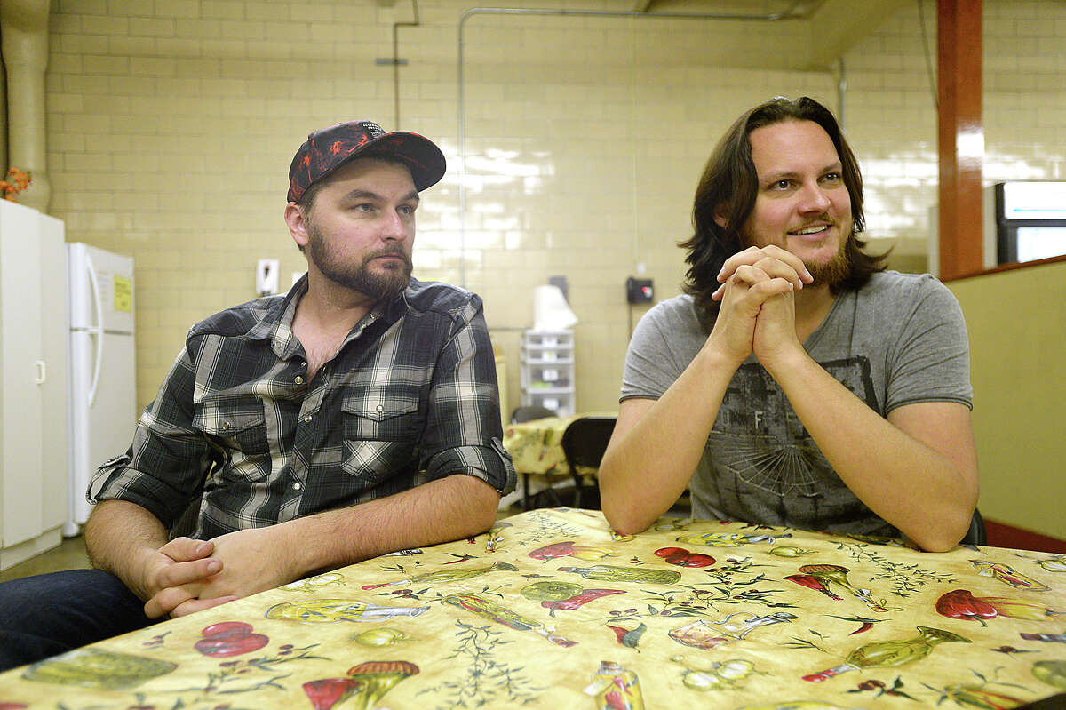 Nederland native Tim Foust (right) and Home Free bandmate Adam Chance talk about their band's efforts to aid those impacted by Tropical Storm Harvey throughout the Southeast Texas region during a stop at the SETX Food Bank to deliver a donation of $15,000 Monday. The money will provide 45,000 meals to those in need. Home Free started a YouCaring fundraising site to aid those in communities throughout Southeast Texas impacted by Tropical Storm Harvey. They have currently raised over $85, 000 of their $100,000 goal. The band, which is currently on its Timeless World Tour, played a show in Lufkin Sunday night, and Foust and Chance decided to take advantage of a free day before heading to Arizona to visit the area and hand deliver some of their donations. Stops Monday included two Orange County schools to whom they have donated materials and instruments to replace those which music students lost to flooding. A large contribution was also made to Nederland Avenue Church of Christ's disaster relief fund to be distributed appropriately to various other schools and victims of Harvey. Photo taken Monday, October 16, 2017 Kim Brent/The Enterprise