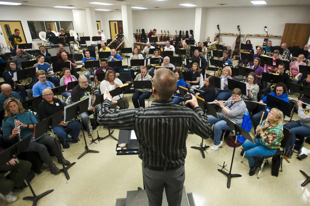 In this file photo, Joel Wiseman conducts the Midland Concert Band during a rehearsal at H. H. Dow High School.
