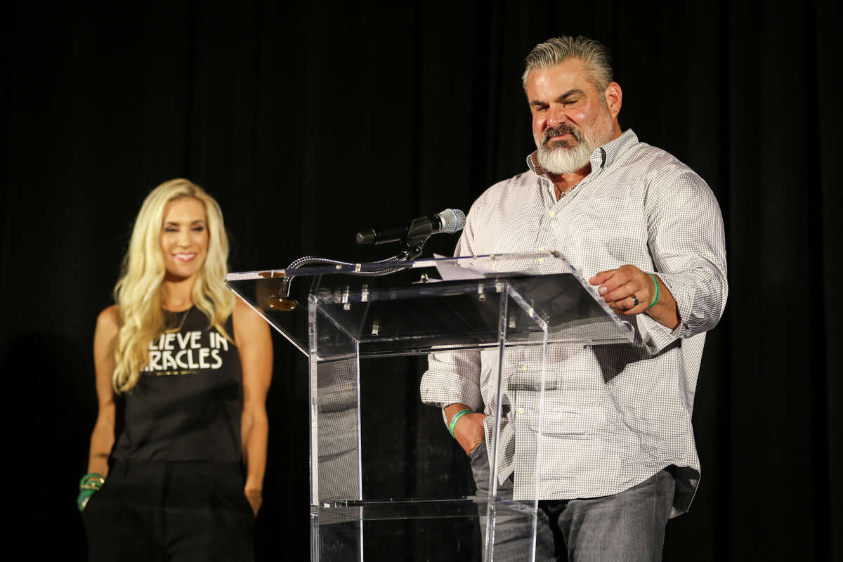 Wayne Herndon, right, accompanied by his wife Missy Herndon, left, speaks during the HOPE Under the Stars Gala on Saturday, Oct. 14, 2017, at The Woodlands Waterway Marriott Hotel & Convention Center.