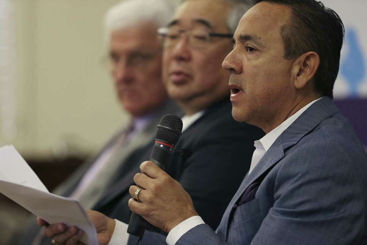 File photo of Texas Senator Carlos Uresti (right), Bexar County district court Judge Peter Sakai (middle) and former commissioner with the Texas Department of Family and Protective Service John Specia. Uresti has listed Sakai and Specia as potential witnesses in his upcoming criminal fraud trial, which starts Monday and may stretch three weeks.