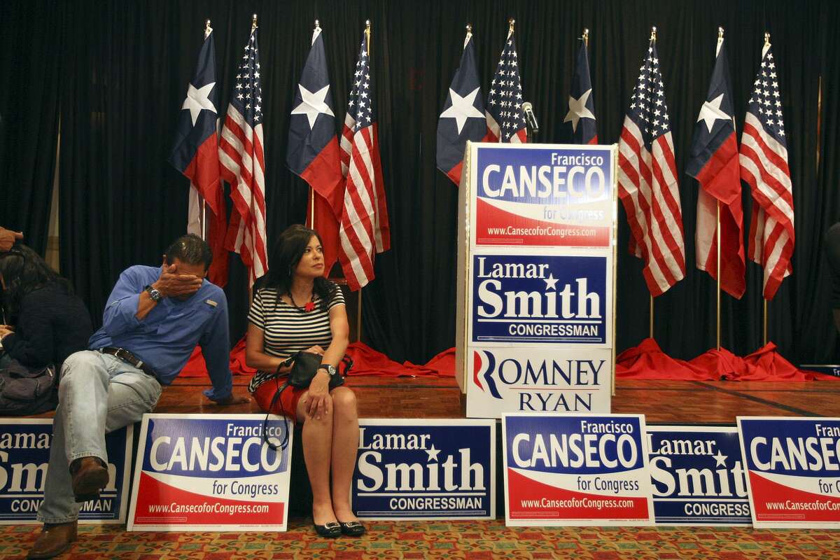 Volunteers Jay Ibarra and Mary Whistler wait for results at the U.S. Rep. Francisco "Quico" Canseco campaign rally at the Holiday Inn Airport on Election Night, Tuesday, Nov. 6, 2012. Canseco headed up to a "war room," to watch the election returns. He is scheduled to meet with supporters later on in the evening. Canseco is in a race with Democrat St. Rep. Pete Gallego, D-Alpine.