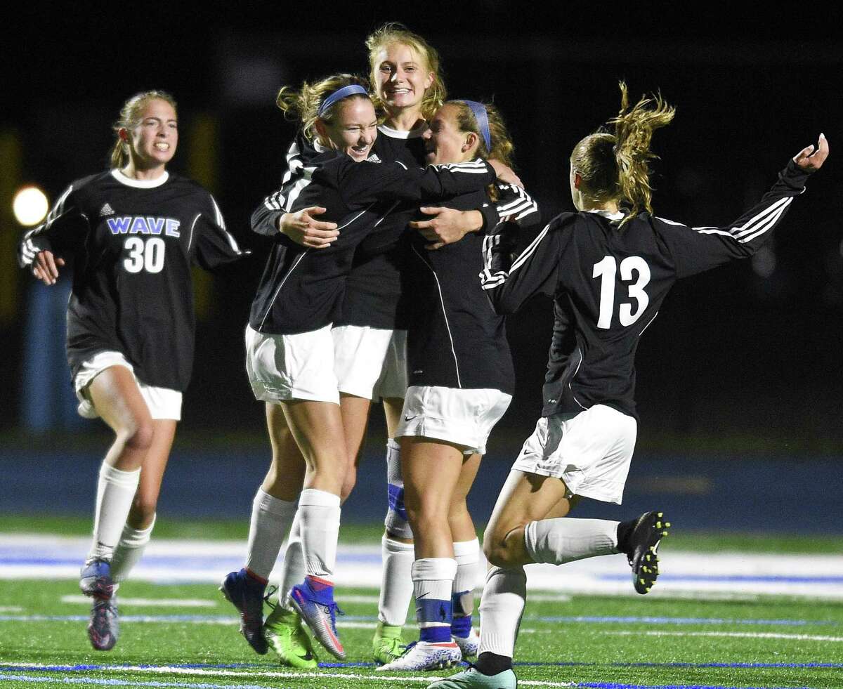 Darien Katie Ramsay (10), center, celebrates her game winning goal against Westhill with teammates in a FCIAC girls soccer game in Darein, Connecticut on Tuesday, Oct.17, 2017. Darien defeated Westhill 1-0.