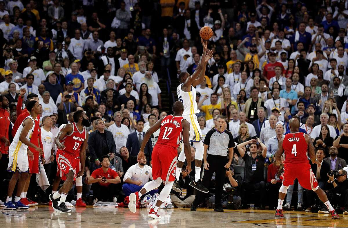 Kevin Durant (35) puts up a last second shot attempt to win the game in the second half as the Golden State Warriors played the Houston Rockets at Oracle Arena in Oakland, Calif., Tuesday, October 17, 2017. Durant's shot was ruled no good after video review and the Warriors lost 122-121.