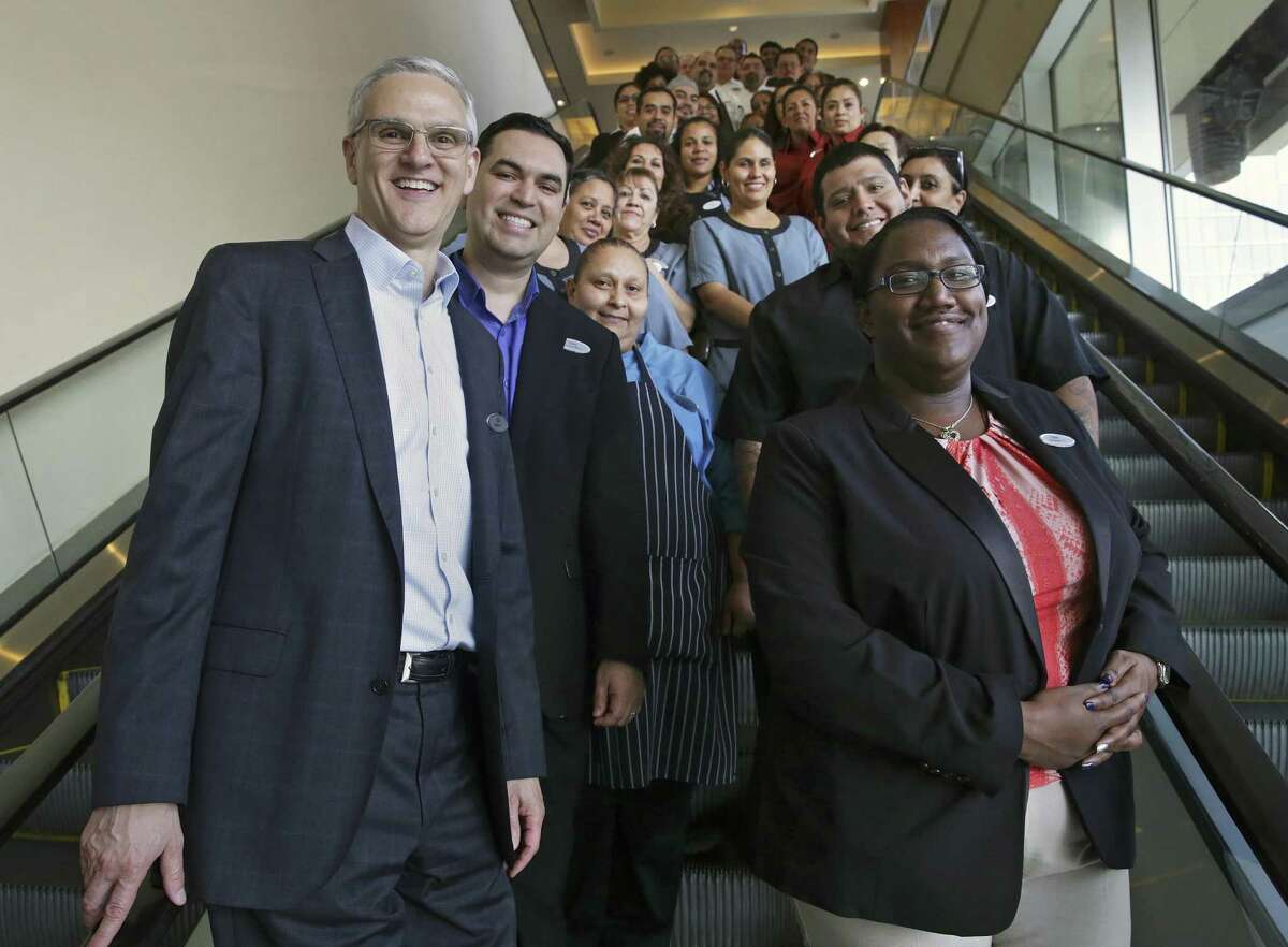 Grand Hyatt General Manager Ed Bucholtz posed for a group photo with employees on one of the hotel's escalators on October 4, 2017. The Hyatt Hotels and Resorts of San Antonio, which includes the Hyatt Regency San Antonio and the Grand Hyatt of San Antonio, won the 2017 Top Workplaces category for large employers in San Antonio.